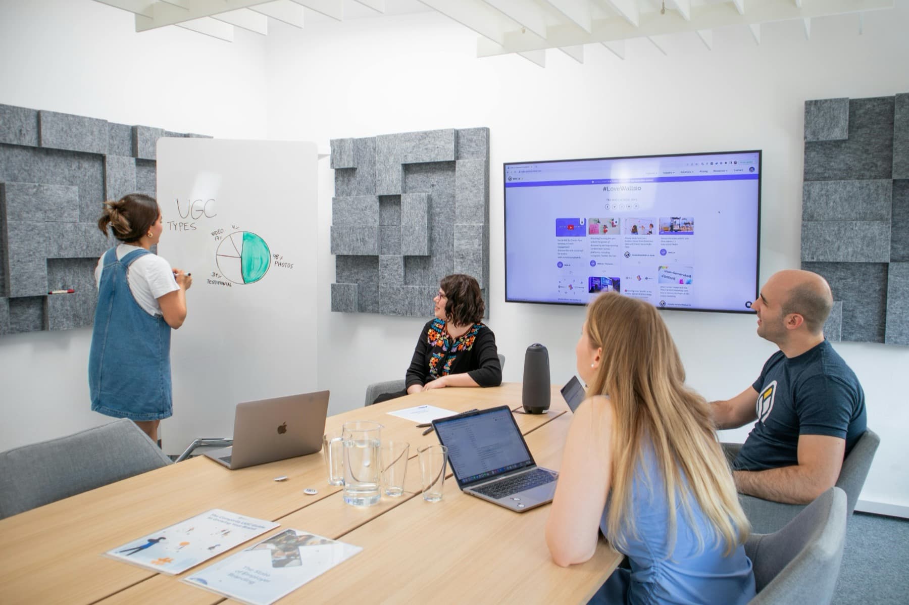 A leadership team in a strategy session around a meeting room table