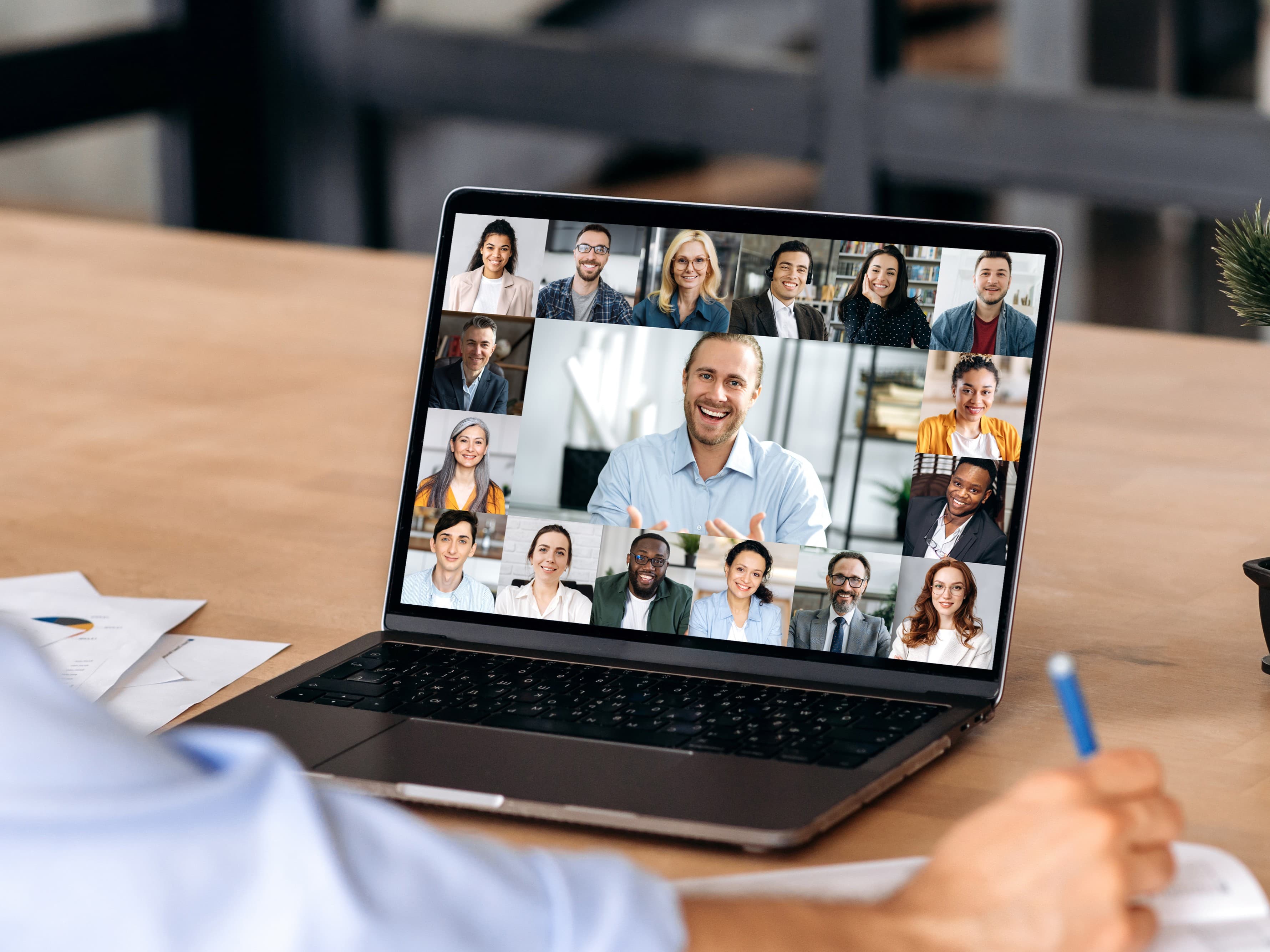 Leader taking notes during an online coaching session